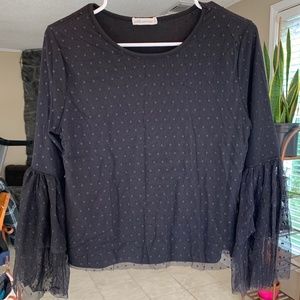 A black polka dot small women’s top.